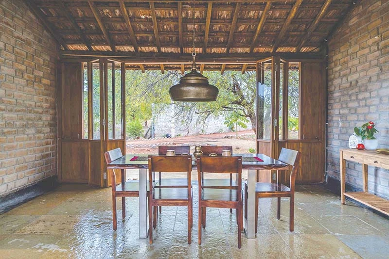 Earthy Farmhouse Design Weaved Around A Traditional Courtyard