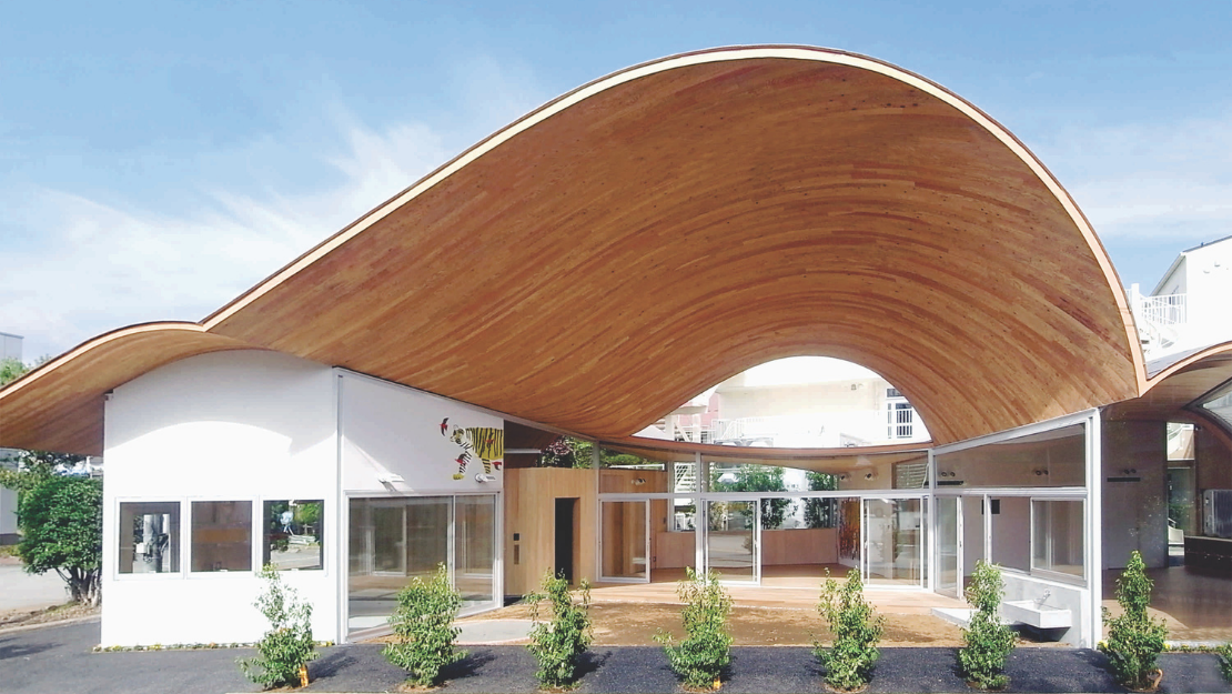 Toranoko Nursery in Japan Creates a Community Space Beneath a Sculptural Curved Roof